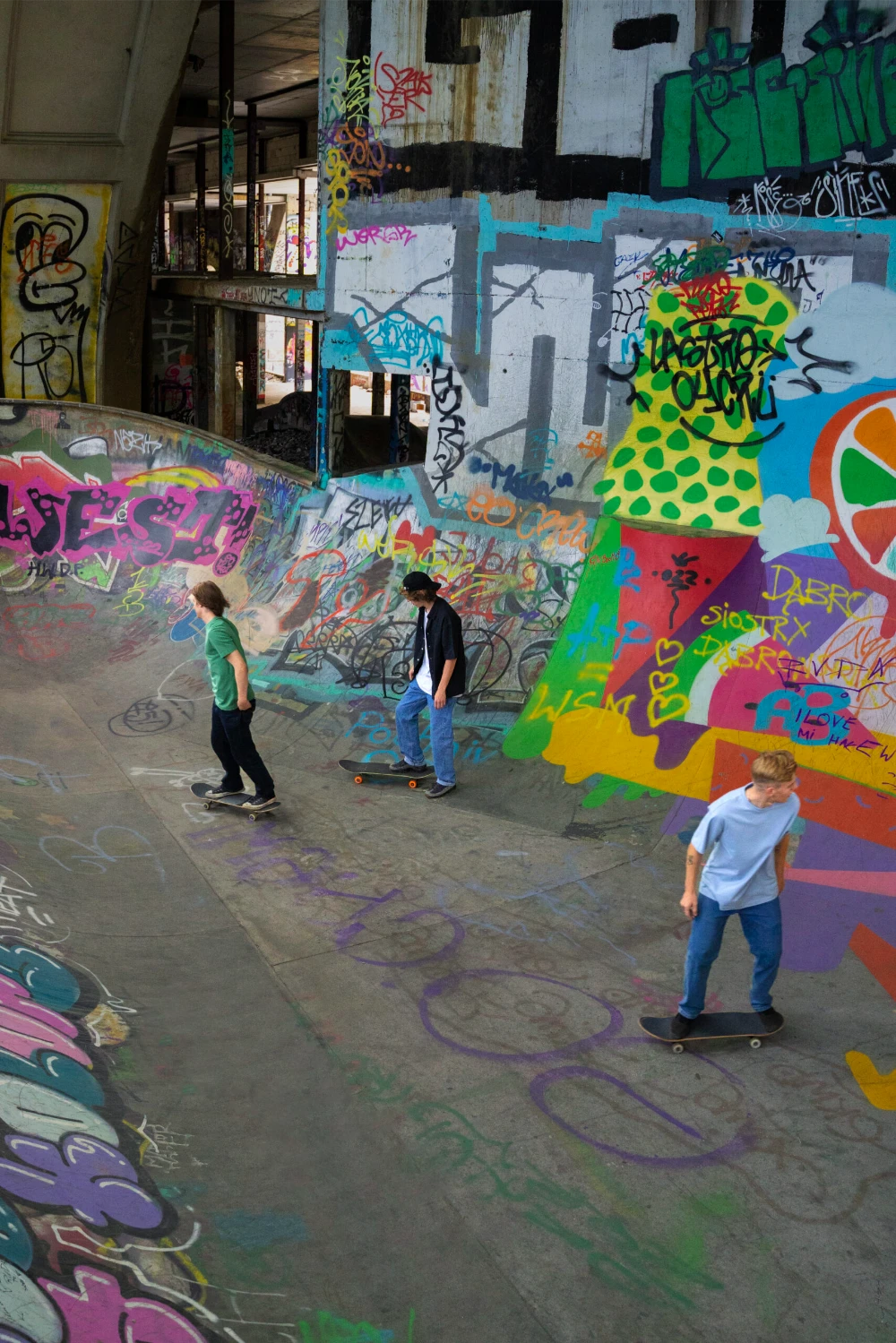 Teens skateboard outdoors high angle